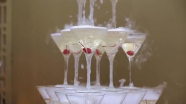 Pyramid tower of champagne glasses at the party, alcohol drinks