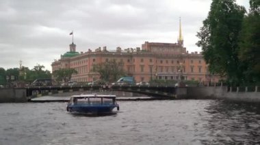 Sailing passenger touristic ship in a city. River tour in Saint-Petersburg.