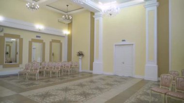 White antique doors in luxurious palace. Yellow walls in historical interior.