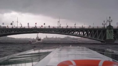 Sailing passenger touristic ship in a city. Lifebuoy, red inflatable ring.