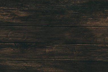 Düğümlü ve tırnak delikli klasik kahverengi ahşap arka plan dokusu. Eski boyalı ahşap duvar. Kahverengi soyut arka plan. Klasik, koyu renk, yatay tahtalar. Kopyalama alanı ile ön görünüm.