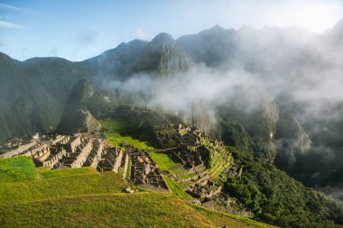 Wonder of the World Machu Picchu in Peru. Beautiful landscape in Andes Mountains with Incan sacred city ruins. 