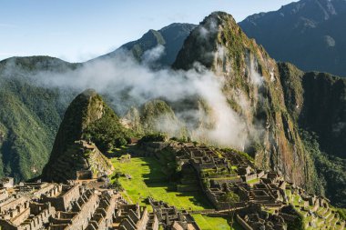 Wonder of the World Machu Picchu in Peru. Beautiful landscape in Andes Mountains with Incan sacred city ruins. 