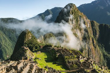 Wonder of the World Machu Picchu in Peru. Beautiful landscape in Andes Mountains with Incan sacred city ruins. 