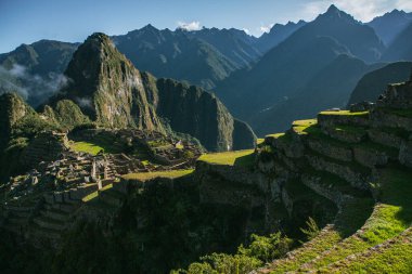 Wonder of the World Machu Picchu in Peru. Beautiful landscape in Andes Mountains with Incan sacred city ruins. 