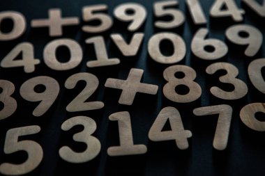 Colorful wooden numbers background. Numbers texture abstraction. Global economy crisis concept 