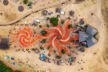 Dadpuszta, Hungary - 07 August, 2022 - Aerial top down view about the main stage at OZORA Festival, one of the greatest psytrance festival in Europe. Psychedelic tribal gathering.