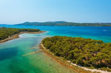 Aerial view about Otok Skoljic next to St. Nicholas Fortress (Croatian: Tvrava sv. Nikole) which located at the entrance to St. Anthony Channel, near the town of Sibenik in central Dalmatia, Croatia.