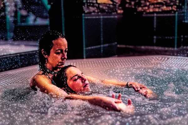 Beauty relaxed woman is massaged in a whirlpool. — Stock Photo, Image