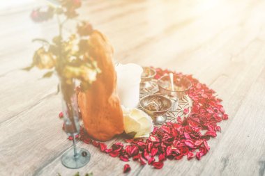 Beautiful altar with rose petals and goddess breasts. ceremony space