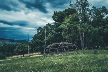 wooden skeleton made for indian sauna in open landscape