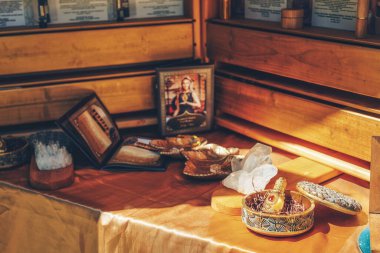 ornamental bottle of perfume and cristal on a wooden background