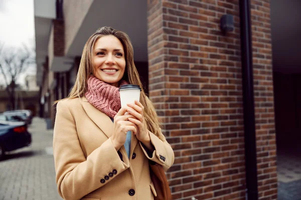 Cheerful Young Woman Coat Scarf Holding Hot Coffee Her Hands — Fotografia de Stock