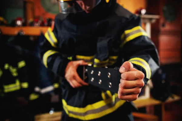 Fireman Putting Protective Uniform Preparing Action While Standing Fire Station — Stock Photo, Image