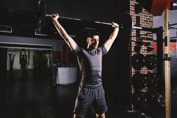 Strong Man Lifting Weights Doing Biceps Exercises Gym — Stock fotografie