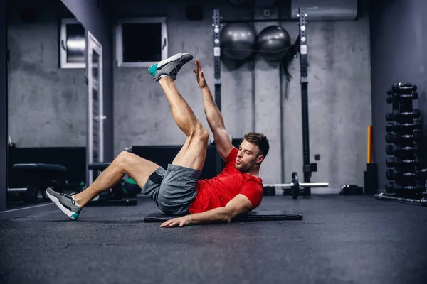 Sports Exercises Cross Training Abs Legs Exercises Young Beautiful Man Royalty Free Stock Photos