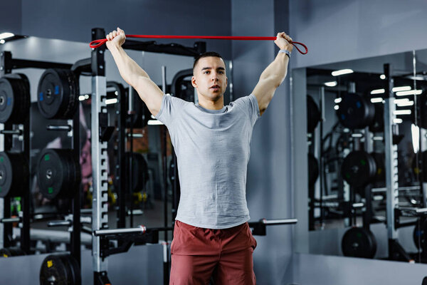 Muscular Sportsman Doing Fitness Exercises Resistance Band Gym Royalty Free Stock Images