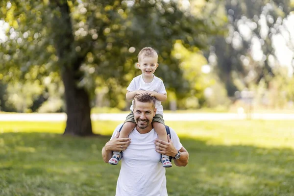 Father and son spend fun time in nature on a sunny summer day.