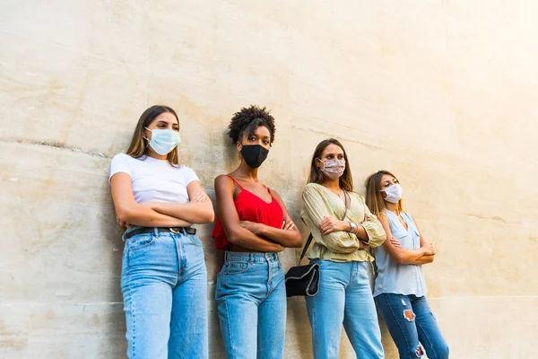 people wearing face protective mask to avoid corona virus spread - Young millennial people portrait during coronavirus outbreak - Health care person and youth multiracial lifestyle friendship concept