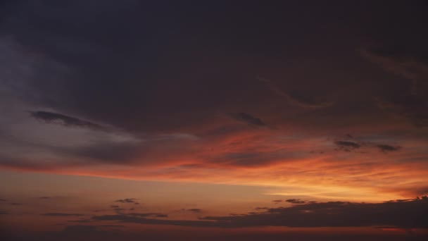 Slow optical zoom out revealing a sunset scenery over a summer river water surface — 비디오