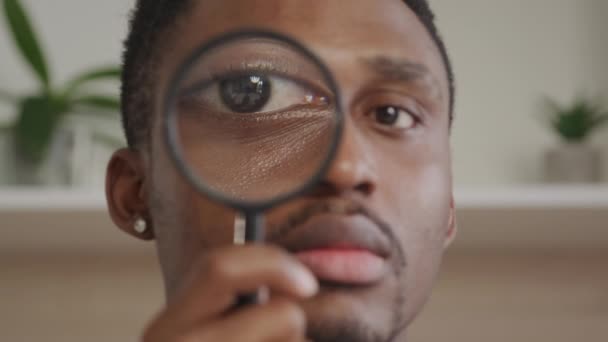 Adult African American Man Looking Magnifying Glass Camera Indoors — Stock Video