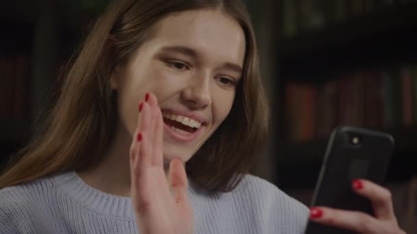 Young Adult Caucasian Woman Waving Her Hand Greeting Video Call — Vídeos de Stock