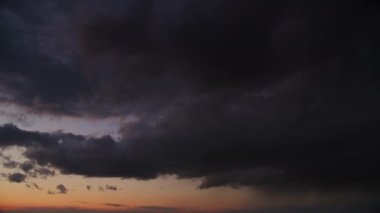 Blizzard storm sky on a sunset wi cumulus clouds and a pouring summer rain in slow motion panorama