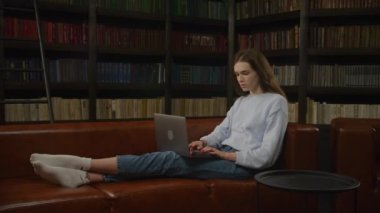 Student caucasian woman opening laptop computer and start working indoors in slow motion