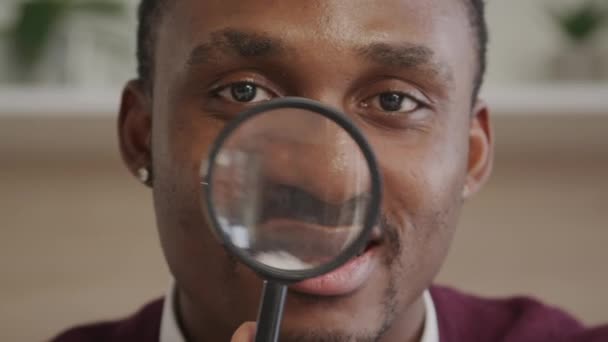 Adult African American Man Looking Magnifying Glass Camera Indoors — Stock Video