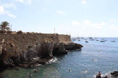 Tabarca, Alicante, Spain Agost 28th, 2022 A View of the beach in Tabarca Island. People are enjoying beautiful blue mediterranean sea in a sunny day