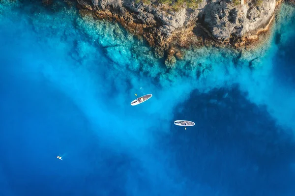 Aerial View People Floating Sup Boards Blue Sea Rocks Stones — 图库照片