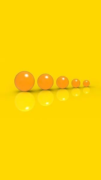 Five Glass Balls Different Sizes Yellow Color Yellow Background Growth — Fotografia de Stock