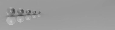 Five balls of metal of different sizes of silver color on gray background. Growth of something. Progress. Reflection. Horizontal image. Banner for insertion into site. 3D image. 3D rendering.