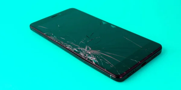Mobile Phone Broken Screen Lies Blue Background Broken Smartphone Electronic — Stock Fotó
