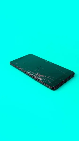 Mobile Phone Broken Screen Lies Blue Background Broken Smartphone Electronic — Stock Fotó