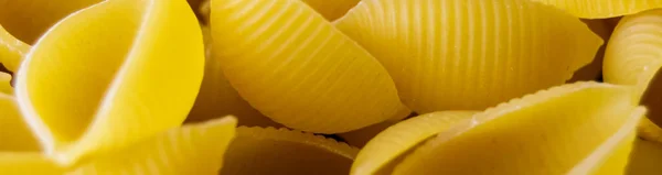 Pasta Conchiglioni Close Yellow Pasta Pasta Texture Banner Insertion Site — Stock Photo, Image