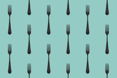 pattern. Fork top view on pastel green blue background. Template for applying to surface. Square image. Flat lay. 3D image. 3D rendering.