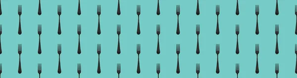 pattern. Fork top view on pastel green blue background. Template for applying to surface. Banner for insertion into site. Flat lay. 3D image. 3D rendering.