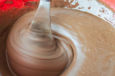 beat with a mixer with brown cake cream. pastry liquid smeared on kitchen utensils. there are air bubbles on the surface of the cream.