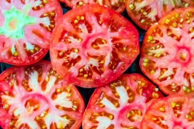 texture of cut tomato. tomato slices. source of vitamins. tomato close-up. Horizontal image