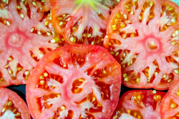 texture of cut tomato. tomato slices. source of vitamins. tomato close-up. Horizontal image