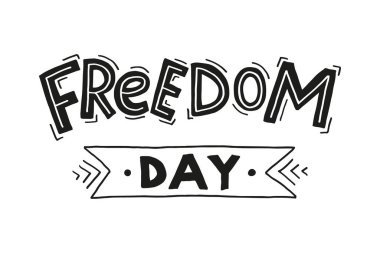 Büyük harflerle yazılmış el yazması Özgürlük Günü. Beyaz ve siyah harfler. Özgürlük kelimesi çizgilerle süslenmiş. Kelime günü kurdele ya da bant üzerine yazıldı. 