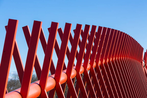 wooden red fence in garden 