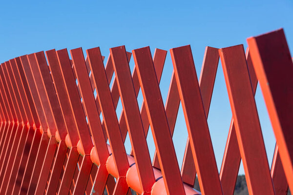 wooden red fence in garden 