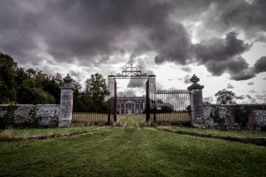 The old and rustic gates from an abandoned country house