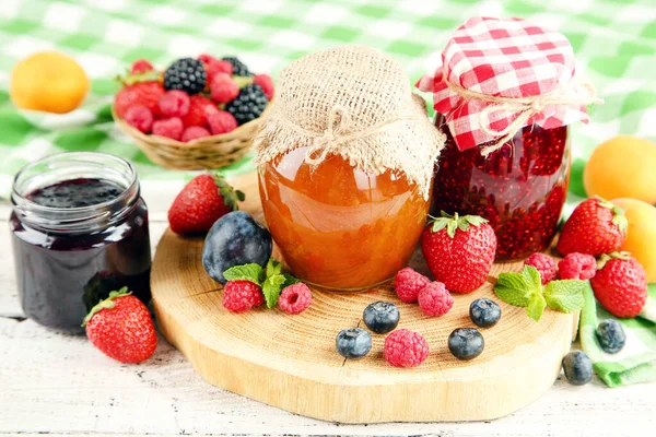 Sweet Jam Glass Jars Ripe Berries White Wooden Table — Stock Photo, Image