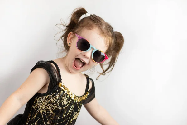 Little Cheerful Girl Two Ponytails Black Gold Dress Sunglasses Studio Stock Photo