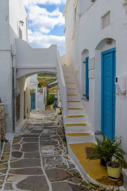 Traditional alley with whitewashed houses  during winter time  in lefkes Paros island clipart