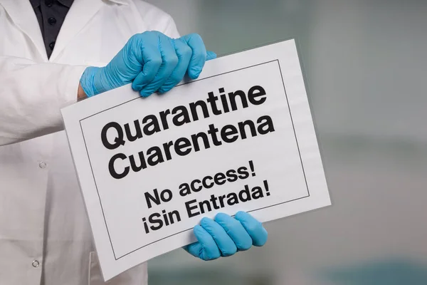 Doctor Hand Medical Gloves Showing English Spanish Quarantine Sign Front — Stock Photo, Image