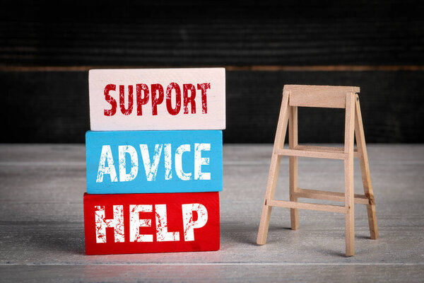 Support, Advice and Help Concept. Colored wooden blocks in a pile and stairs